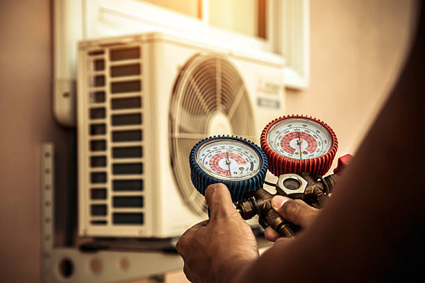 Professional Air Conditioning Service technician working in Williston, ND